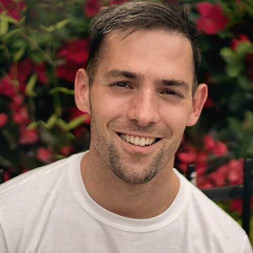 Man outside in white t-shirt