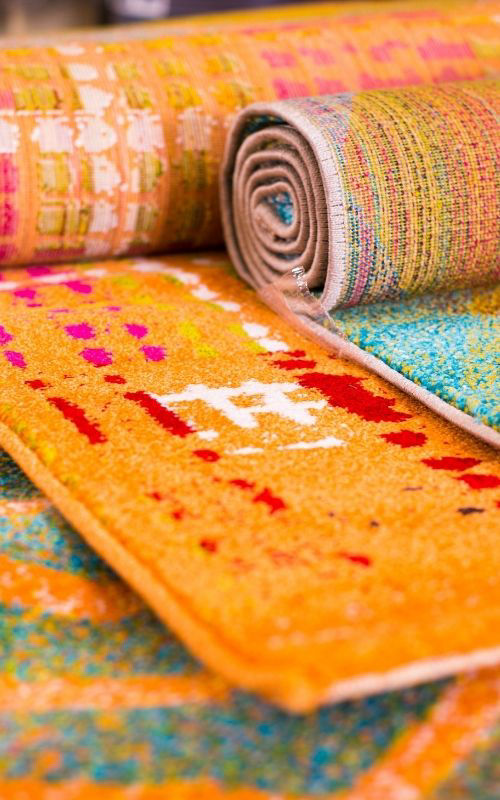 Colourful synthetic area rugs cleaned by Ecosuds Grimsby Ontario